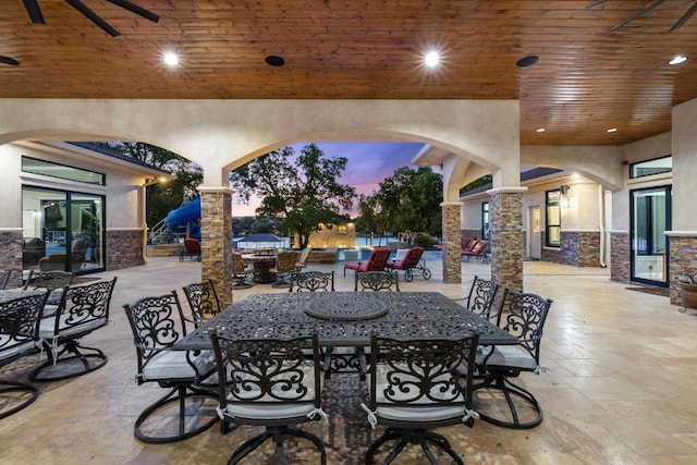 911 Legends Pkwy, Kingsland, TX 78639 - patio terrace at dusk featuring outdoor dining area and a patio