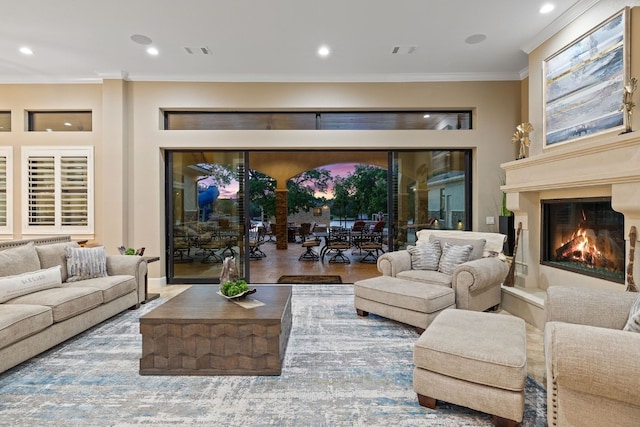 living room with ornamental molding and hardwood / wood-style flooring