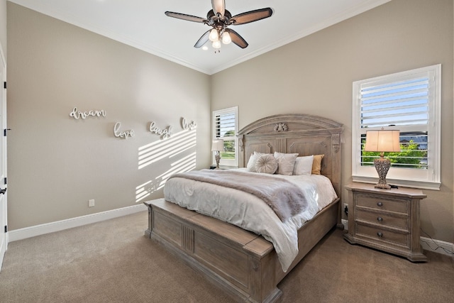 carpeted bedroom with crown molding and ceiling fan