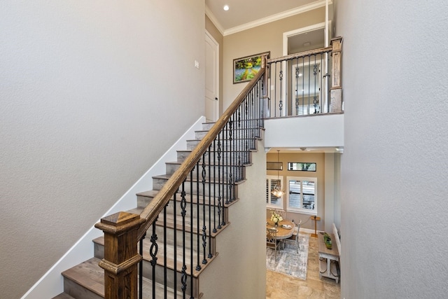 stairs featuring crown molding and tile patterned flooring