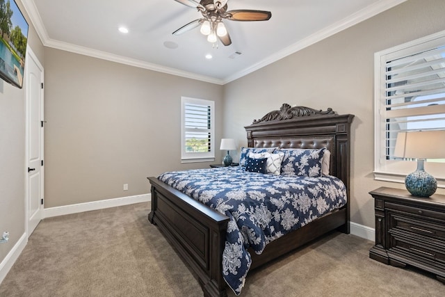 carpeted bedroom featuring ceiling fan and ornamental molding