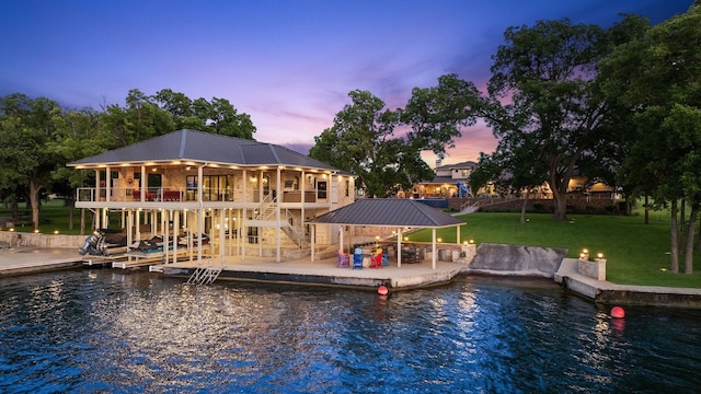 911 Legends Pkwy, Kingsland, TX 78639 - dock featuring a patio area, stairs, a lawn, and a water view