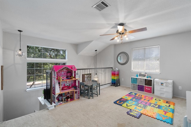 playroom featuring vaulted ceiling, light colored carpet, and ceiling fan