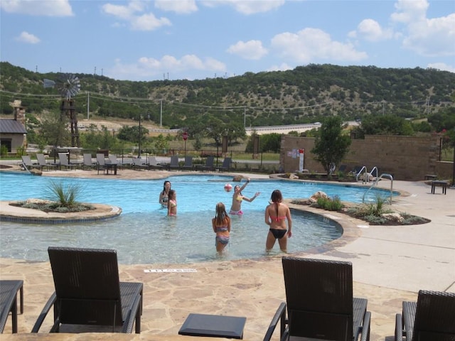 view of pool featuring a patio area