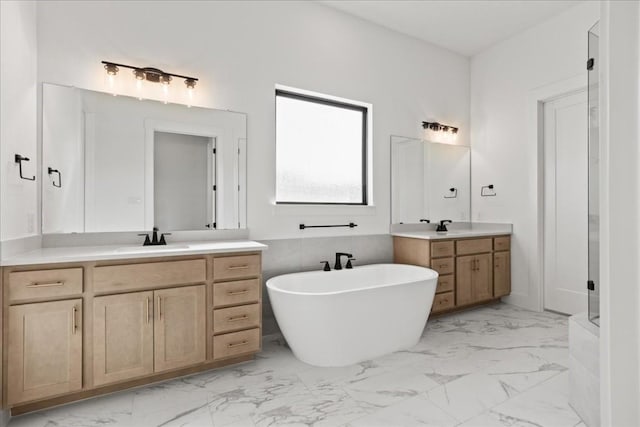 bathroom featuring a bath and vanity