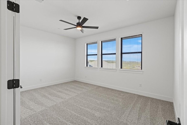 empty room with light carpet and ceiling fan