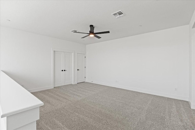 carpeted empty room with ceiling fan