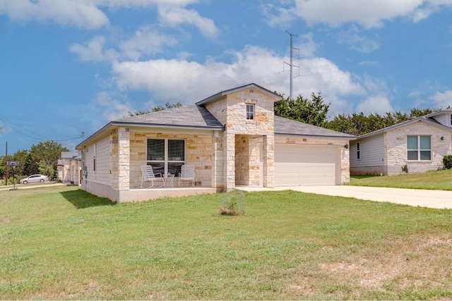 view of front of house featuring a garage and a front yard