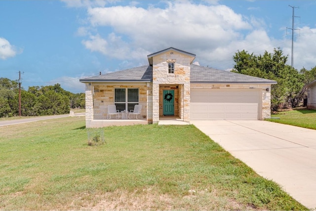 view of front facade featuring a garage and a front lawn