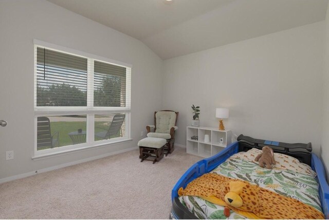 carpeted bedroom featuring vaulted ceiling