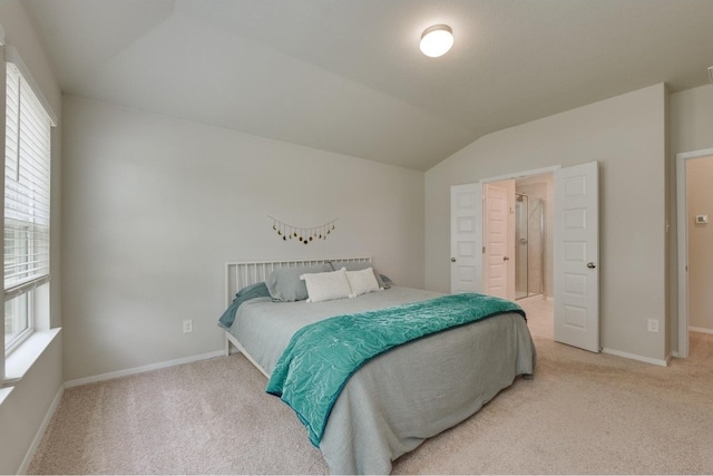 carpeted bedroom featuring vaulted ceiling