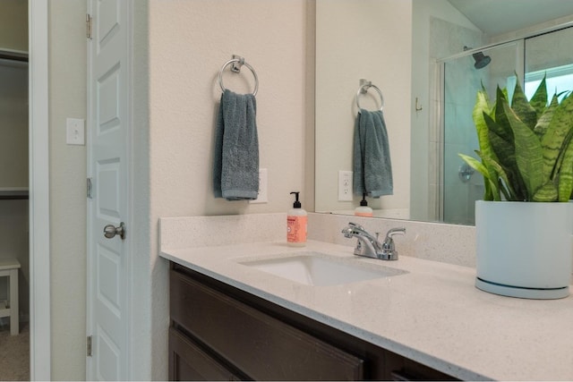 bathroom with vanity and an enclosed shower