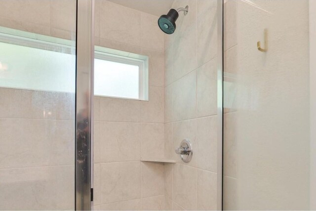 bathroom featuring an enclosed shower