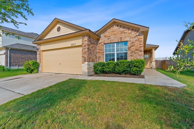 view of front of house featuring a garage and a front yard