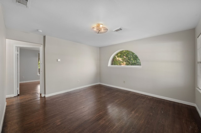 unfurnished room with hardwood / wood-style floors