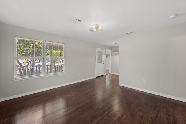 spare room featuring hardwood / wood-style floors