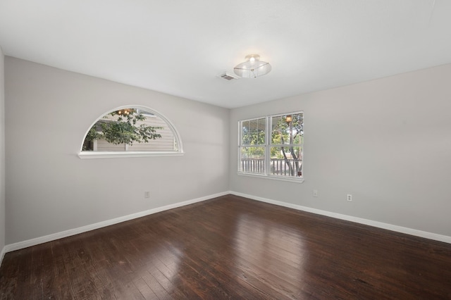 empty room with wood-type flooring