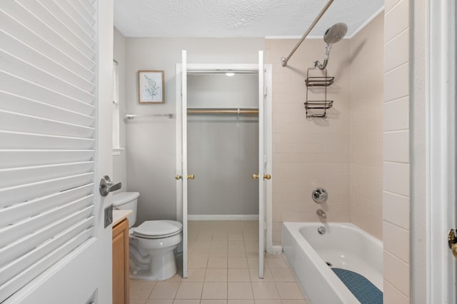 full bathroom with tile patterned flooring, a textured ceiling, tiled shower / bath, toilet, and vanity