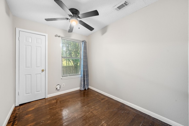 unfurnished bedroom featuring a textured ceiling, hardwood / wood-style flooring, and ceiling fan