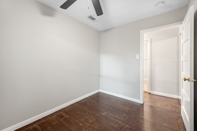 spare room with ceiling fan and wood-type flooring