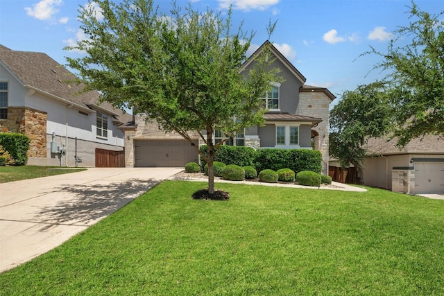 view of front of property with a garage and a front lawn