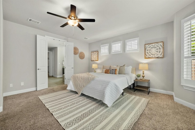 bedroom featuring ceiling fan and light carpet