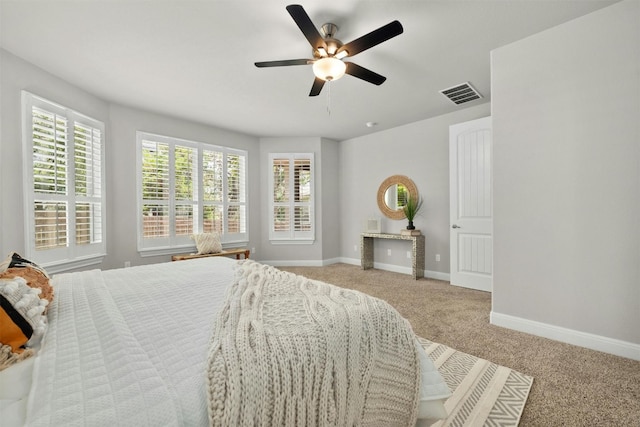 bedroom featuring ceiling fan and light carpet