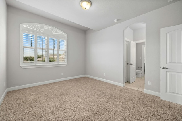 empty room featuring light colored carpet