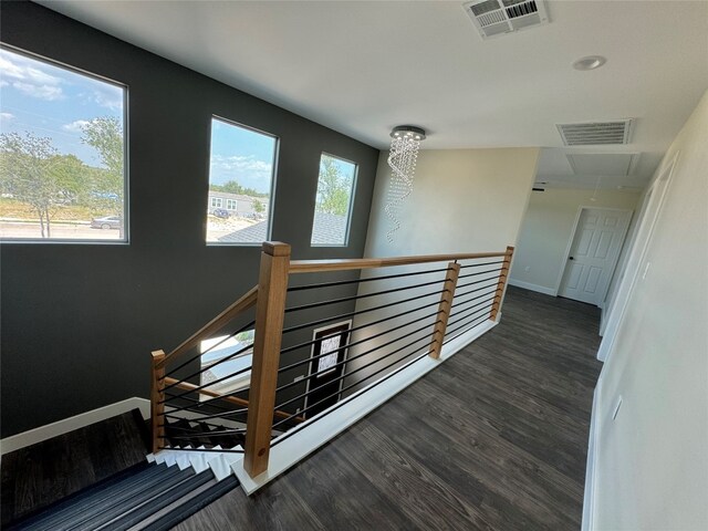 stairway featuring dark hardwood / wood-style flooring