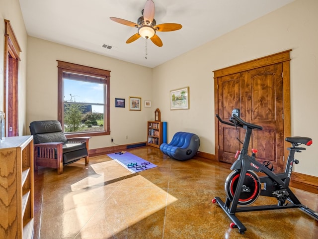 workout room featuring ceiling fan, visible vents, and baseboards