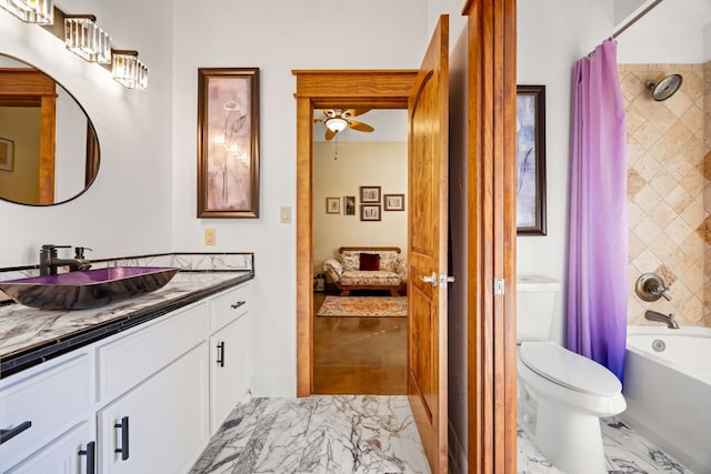 bathroom with marble finish floor, shower / bath combo with shower curtain, vanity, and toilet