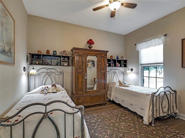 bedroom featuring ceiling fan and dark hardwood / wood-style flooring