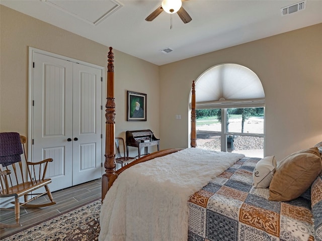 bedroom with ceiling fan, wood-type flooring, and a closet