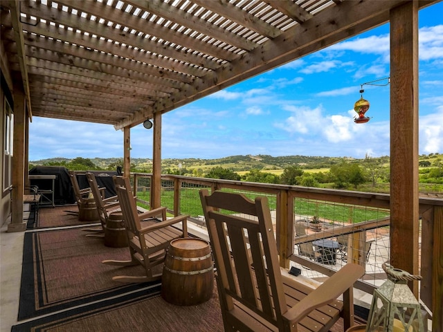 wooden terrace with a pergola