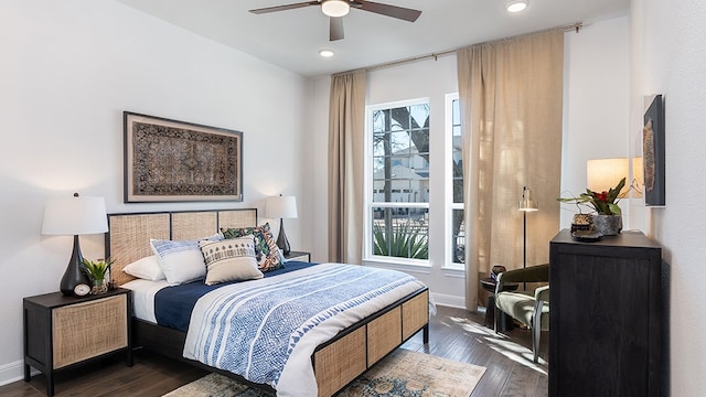 bedroom featuring dark hardwood / wood-style floors and ceiling fan