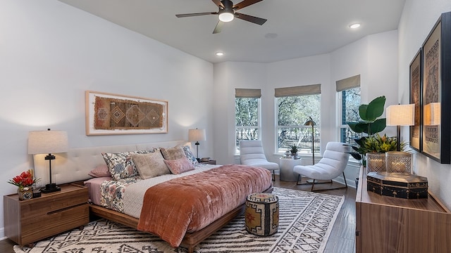 bedroom with hardwood / wood-style floors and ceiling fan