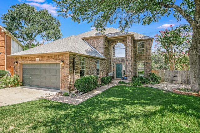 view of front of property with a garage and a front yard