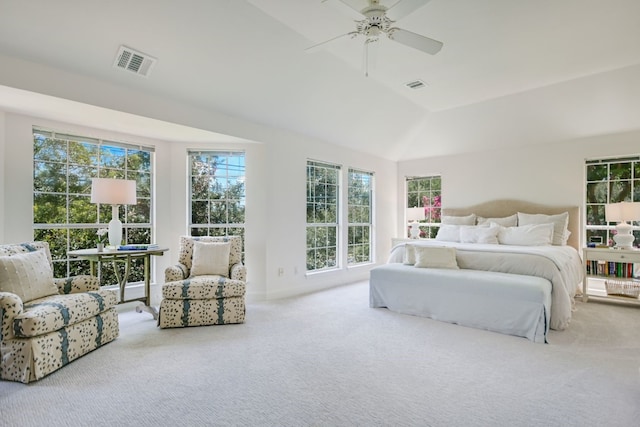 carpeted bedroom with vaulted ceiling and ceiling fan