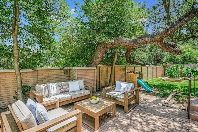 view of patio featuring a wooden deck and an outdoor living space