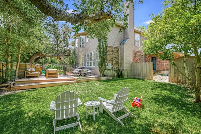 view of yard with a wooden deck