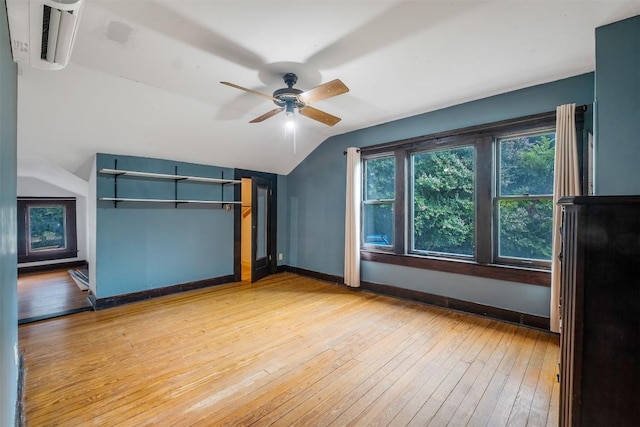 bonus room featuring lofted ceiling, ceiling fan, light wood-style flooring, visible vents, and baseboards