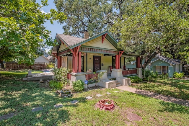 view of front facade with a porch and a front lawn