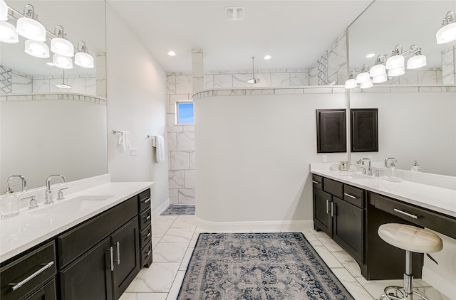 bathroom with vanity and a tile shower