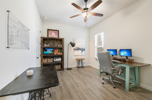 office area with ceiling fan and light hardwood / wood-style flooring