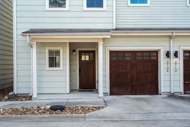 view of exterior entry featuring a garage