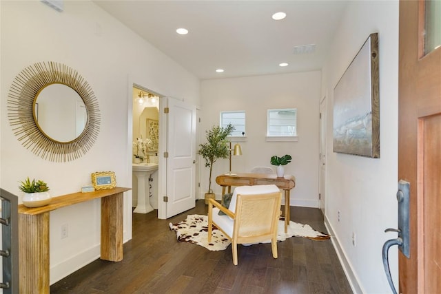 living area with dark hardwood / wood-style floors