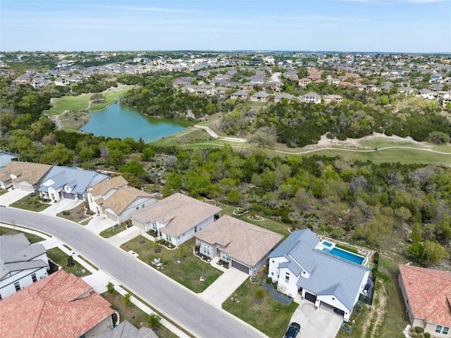 bird's eye view featuring a residential view and a water view