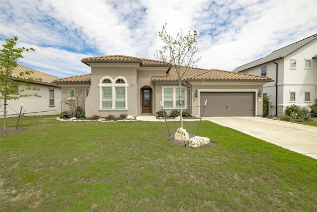 mediterranean / spanish-style home featuring concrete driveway, a tile roof, an attached garage, a front lawn, and stucco siding