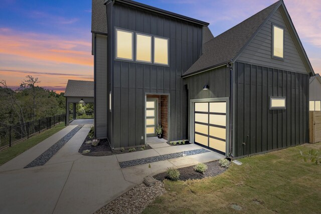 view of front of house with a yard and a garage