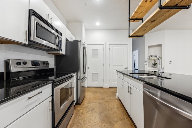 kitchen with sink, stainless steel appliances, and white cabinets